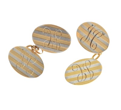 Lot 142 - Yellow and white metal oval cufflinks