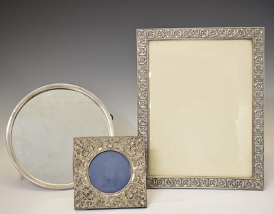 Lot 257 - Edward VII silver-mounted easel photo frame, a French white metal mounted mirror, etc