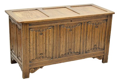 Lot 819 - Reproduction oak three-panel linenfold coffer / bedding chest