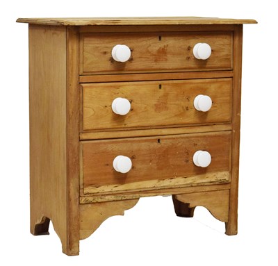 Lot 806 - Pine chest of three drawers with white ceramic handles