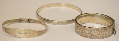 Lot 154 - Three silver bangles