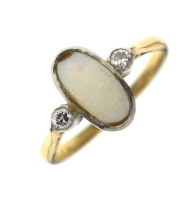 Lot 40 - Yellow metal, opal and two stone diamond ring