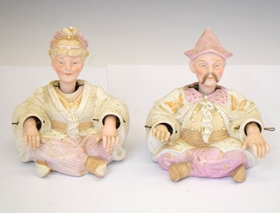 Lot 576 - Continental bisque porcelain nodding-head pagoda figure and companion