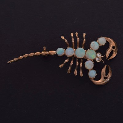 Lot 80 - Unmarked rose metal and opal scorpion brooch