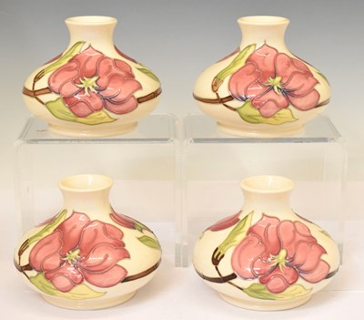Lot 566 - Moorcroft - Four vases in the Magnolia pattern on cream ground