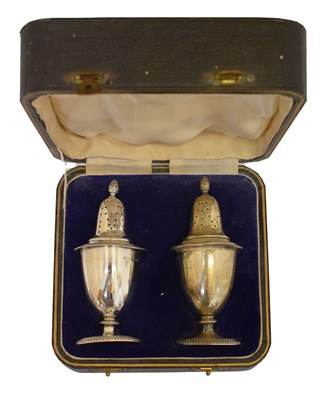 Lot 222 - Pair of George V silver pepperettes
