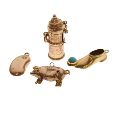 Lot 149 - Four charms, comprising a late Victorian 9ct gold temperance capsule charm, etc