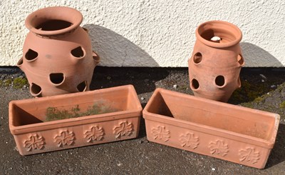 Lot 749 - Two rectangular terracotta garden troughs, together with two terracotta strawberry planters