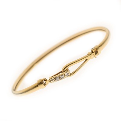 Lot 121 - Solar Diamonds - 18ct gold and diamond set bangle