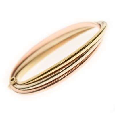 Lot 122 - Tri-colour 9ct gold bangle