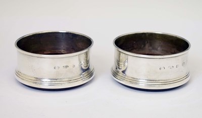 Lot 225 - Two silver wine coasters