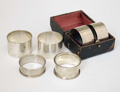 Lot 245 - Pair of George V cased silver napkin rings