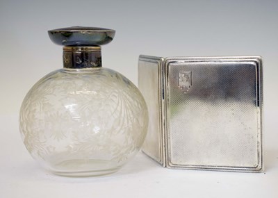 Lot 240 - George VI silver cigarette case, together with a George V silver-topped perfume bottle