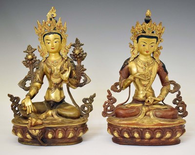 Lot 590 - Two Tibetan gilt alloy figures