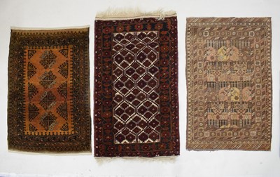 Lot 700 - Three small Middle Eastern rugs