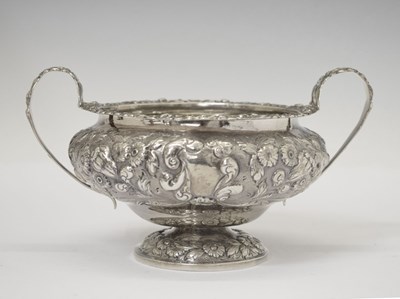 Lot 341 - Georgian twin-handled sugar bowl with repoussé floral decoration