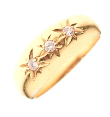 Lot 2 - '18ct' yellow metal ring set three white stones