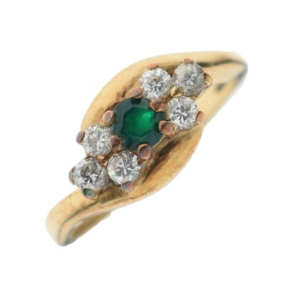 Lot 5 - 9ct gold green and white stone crossover dress ring