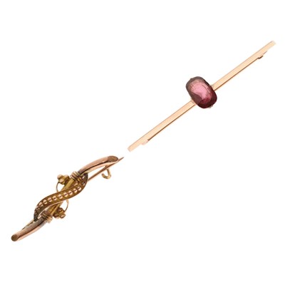Lot 79 - Victorian '9ct' bar brooch, and a yellow metal bar brooch set pink / purple coloured stone