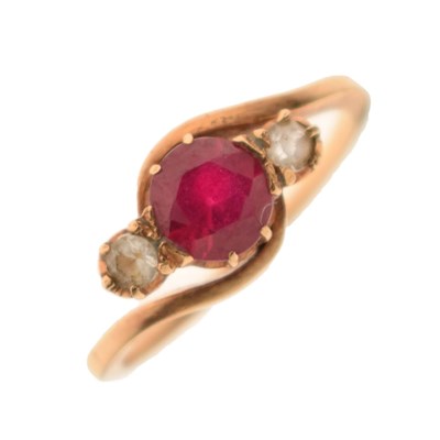 Lot 37 - Synthetic ruby and white stone three-stone crossover yellow metal ring