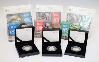 Lot 360 - Three Elizabeth II silver proof Dinosaur 50p coins, together with three coloured 50p coin packs