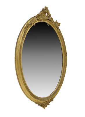Lot 701 - Large giltwood and gesso oval wall mirror, circa 1900