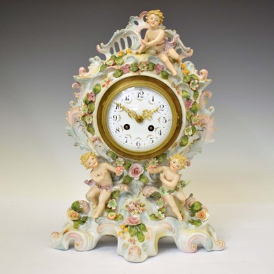 Lot 573 - Continental porcelain figural mantel clock