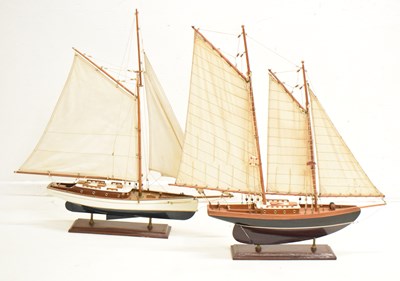 Lot 542 - Two wooden model yachts in full sail