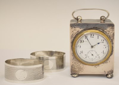 Lot 260 - Pair of George V silver napkin rings together with a George V silver cased desk clock