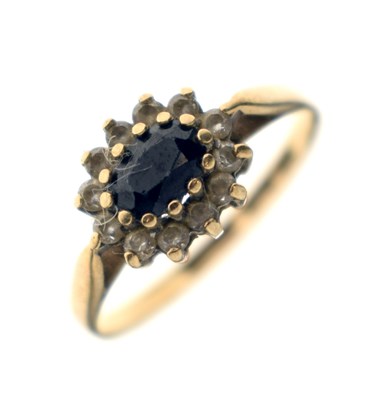 Lot 50 - Sapphire and cubic zirconia 9ct gold cluster ring