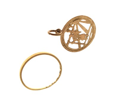 Lot 83 - Victorian 22ct wedding band (af/) and a St Christopher charm (2)