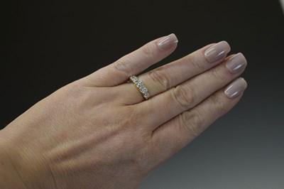 Lot 8 - Unmarked yellow metal five-stone diamond ring