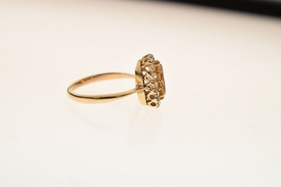 Lot 29 - Imperial yellow topaz and diamond cluster ring