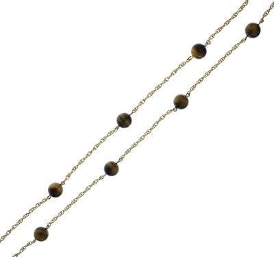 Lot 68 - Tiger's eye and yellow metal necklace