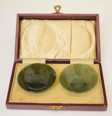 Lot 586 - Small pair of Chinese 'spinach jade' (nephrite) bowls in fitted case