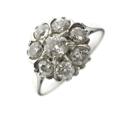 Lot 16 - Diamond eight-stone cluster white metal ring