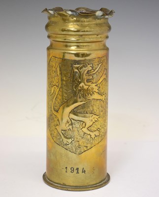 Lot 294 - Great War brass trench art shell casing / vase with embossed shield decoration