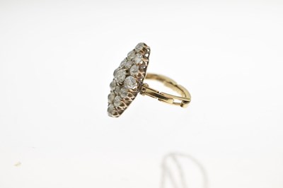 Lot 11 - Early 20th century diamond marquise yellow metal ring