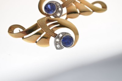 Lot 44 - Sapphire and diamond scroll brooch