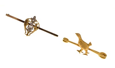 Lot 94 - Yellow metal grouse brooch, stamped '10ct', and a rose cut diamond set bar brooch, stamped '9ct' (2)