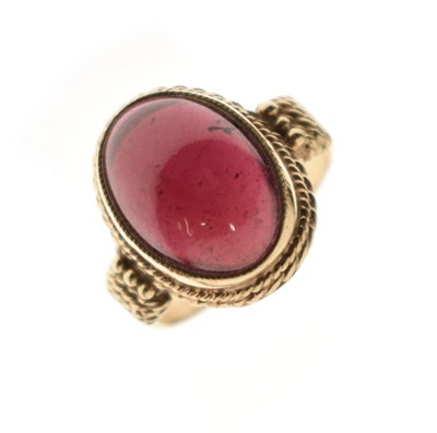 Lot 68 - Garnet unmarked yellow metal ring