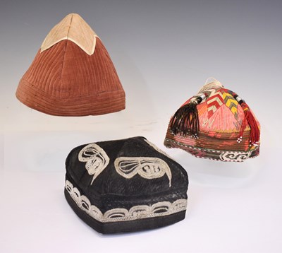 Lot 572 - Early 20th century Indian or Central Asian 'Kullah' cap, and two Uzbek tubeteikas