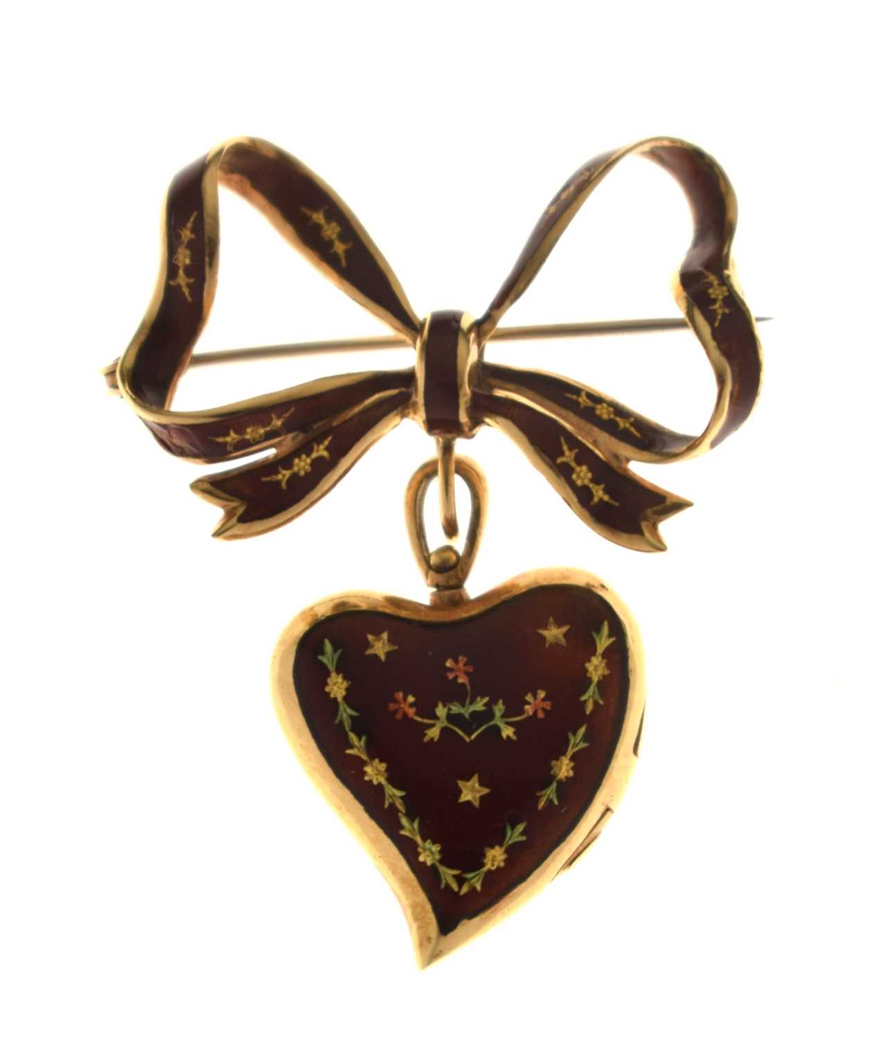 Lot 45 - Yellow metal (750) and red enamel decorated heart-shaped locket on a tied bow brooch fitting