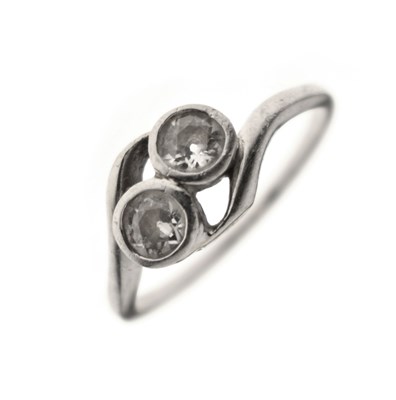 Lot 5 - Diamond two stone unmarked white metal crossover ring