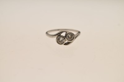 Lot 5 - Diamond two stone unmarked white metal crossover ring