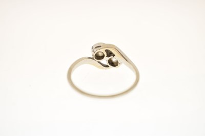 Lot 5 - Diamond two stone unmarked white metal crossover ring
