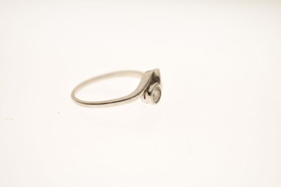 Lot 5 - Diamond two stone unmarked white metal crossover ring