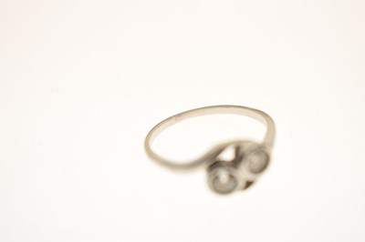 Lot 5 - Diamond two stone unmarked white metal crossover ring