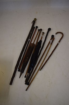 Lot 586 - Bundle of walking sticks and parasols