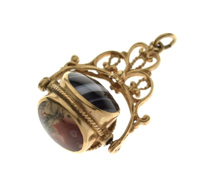 Lot 101 - 9ct gold swivel fob seal set three oval hardstone panels